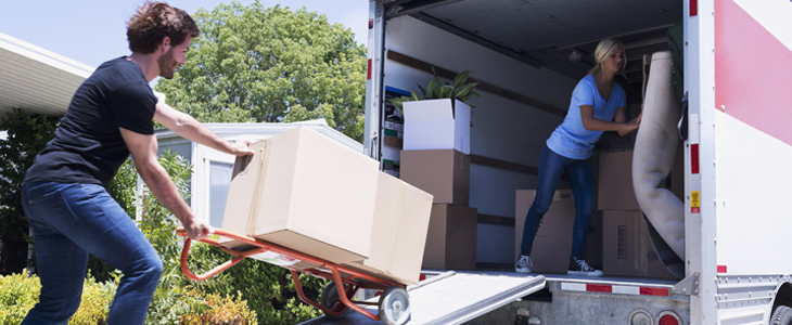 loading packages on a truck for moving